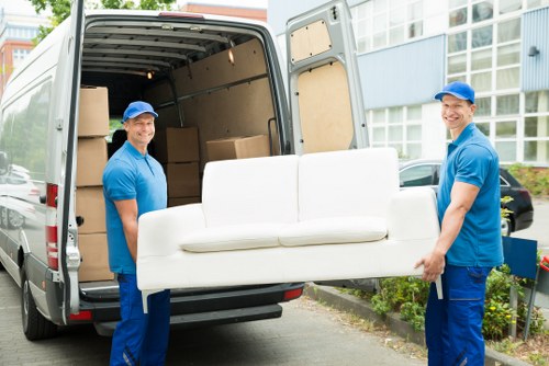 Man and van loading furniture in Honor Oak