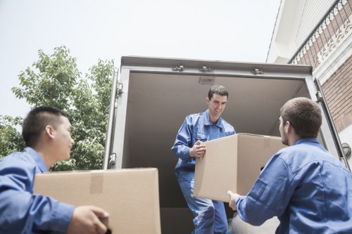 Local man and van loading furniture in Honor Oak street