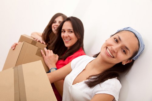 Packed office equipment and furniture prepared for a local move