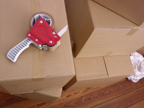 Trained mover using protective gloves during a relocation