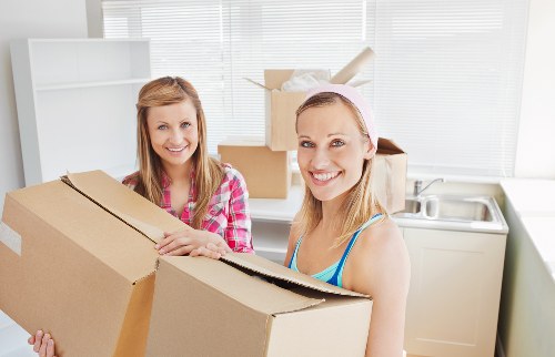 Packed moving boxes and furniture for a flat removal service
